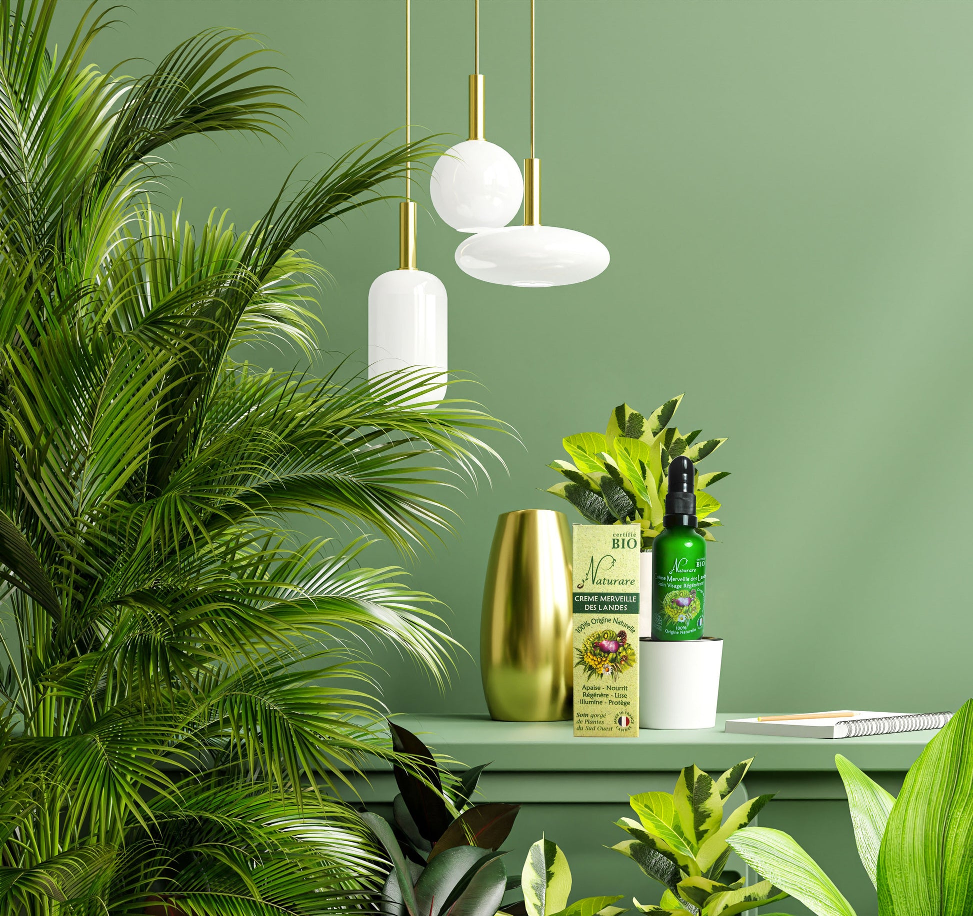 Decorative setup with plants, a gold vase, and green bottles against a green wall.